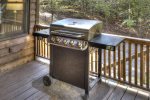 Gas grill on covered porch